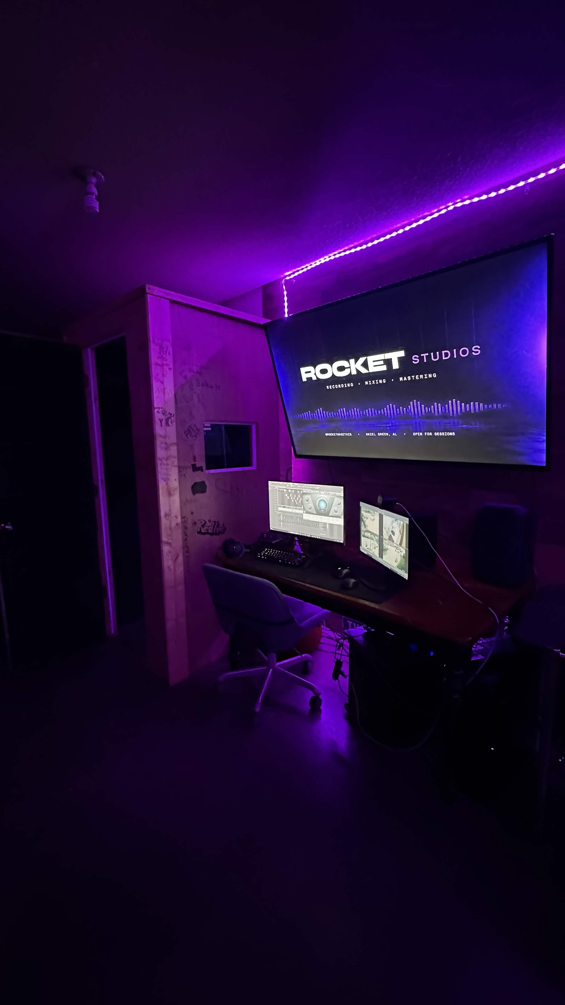 Rocket Studios engineering desk with the vocal booth beside it